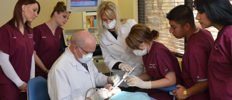 AIDA students learn hands-on helping patients in an onsite dental clinic