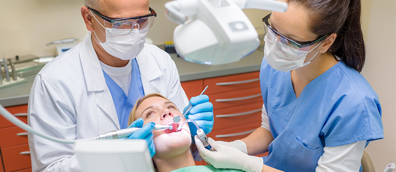 Dentist with Dental Assistant